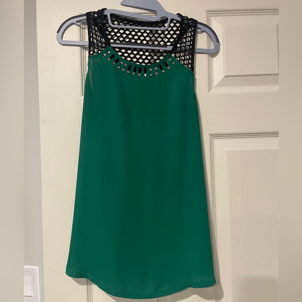 Women’s express green sleeveless blouse with black netting. Size m